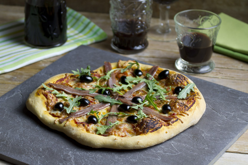 Pizza de anchoas y rúcula